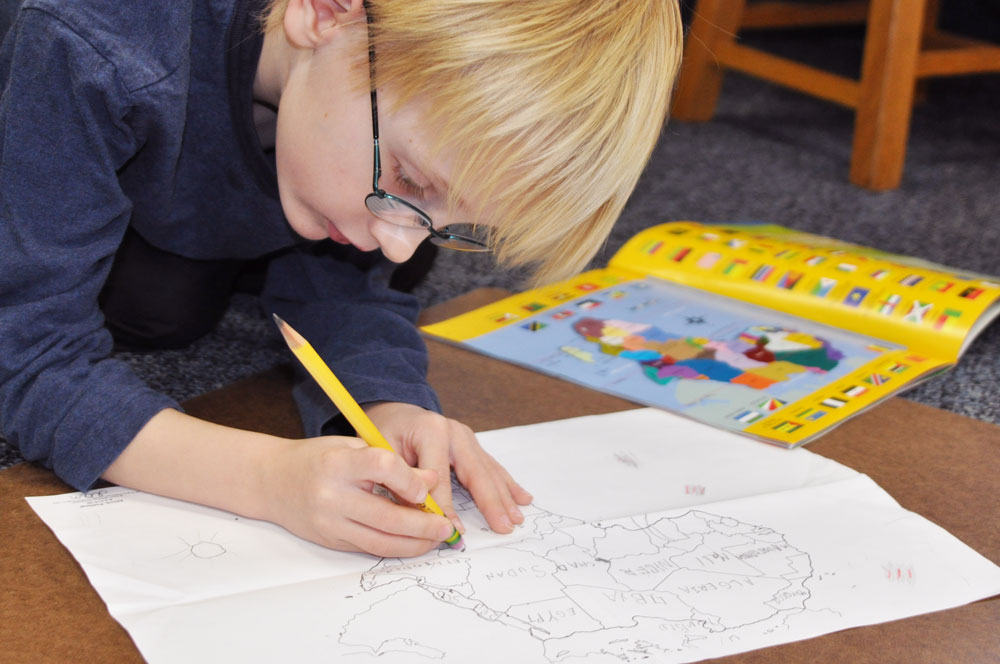 Montessori Elementary Student and Map